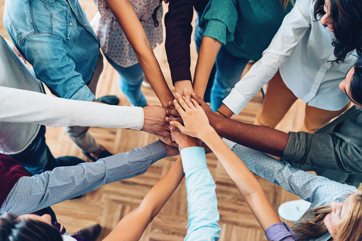 Hands in centre to demonstrate cultural diversity