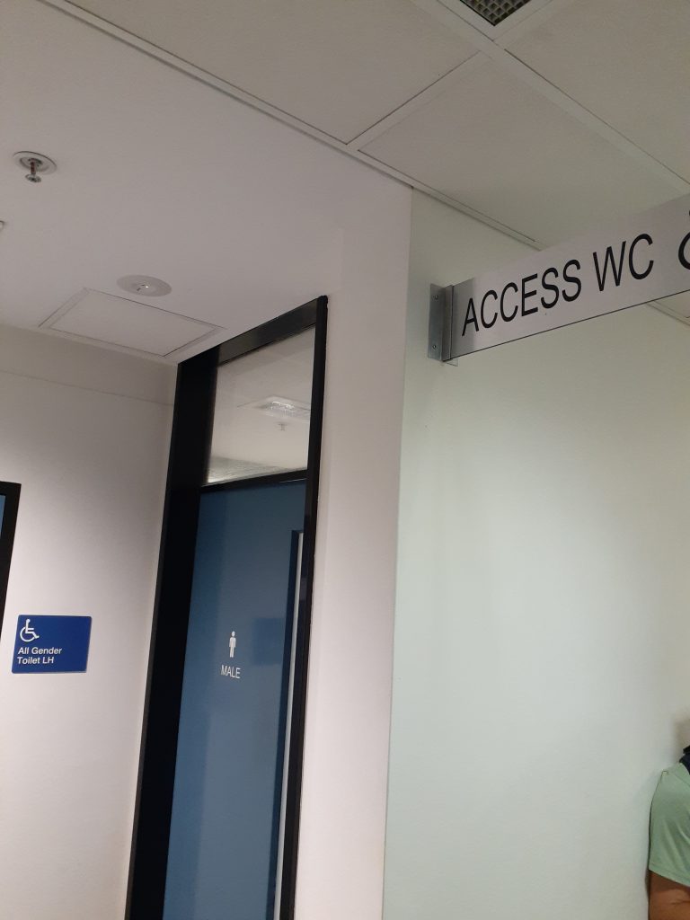 A sign fixed to the wall reads 