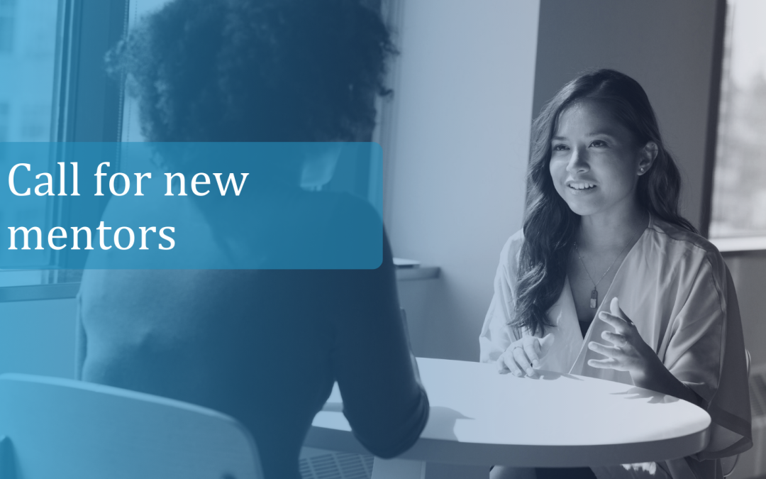 two women at a table chatting