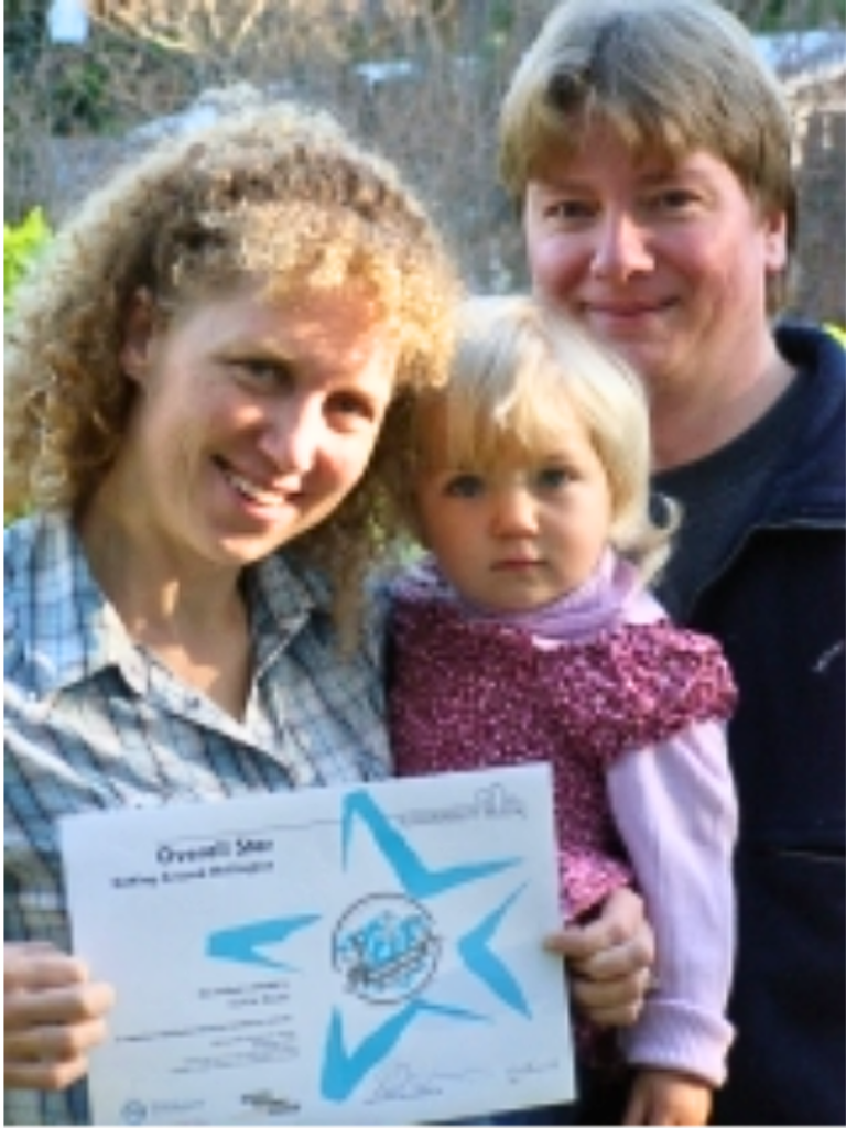 Sylvia and Matthew Bauer with daughter